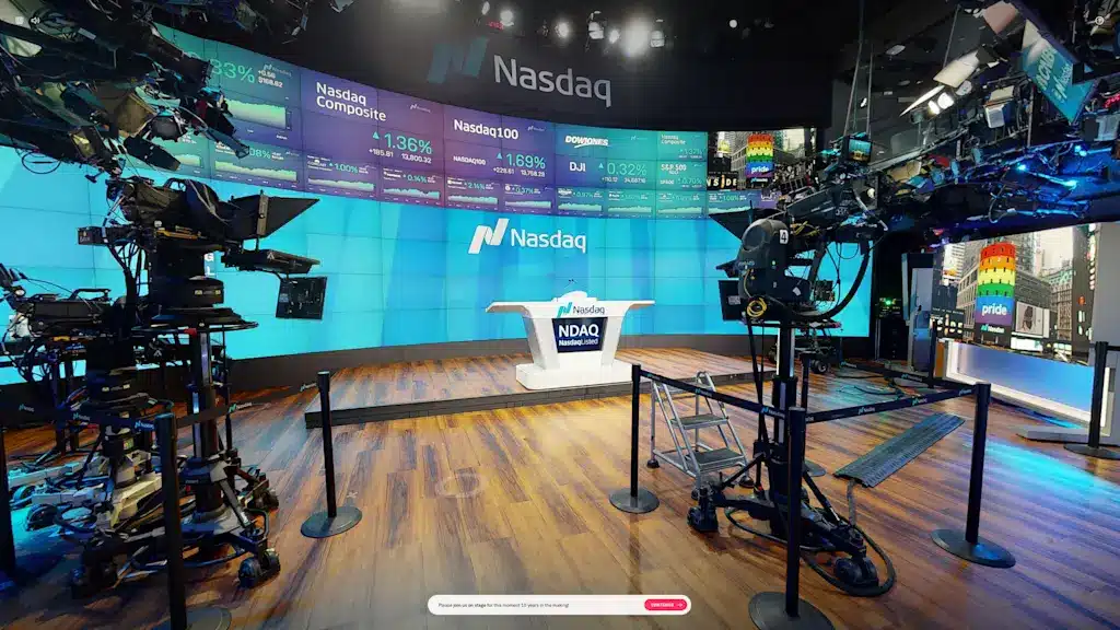 Interior of Nasdaq MarketSite with screens displaying market data.