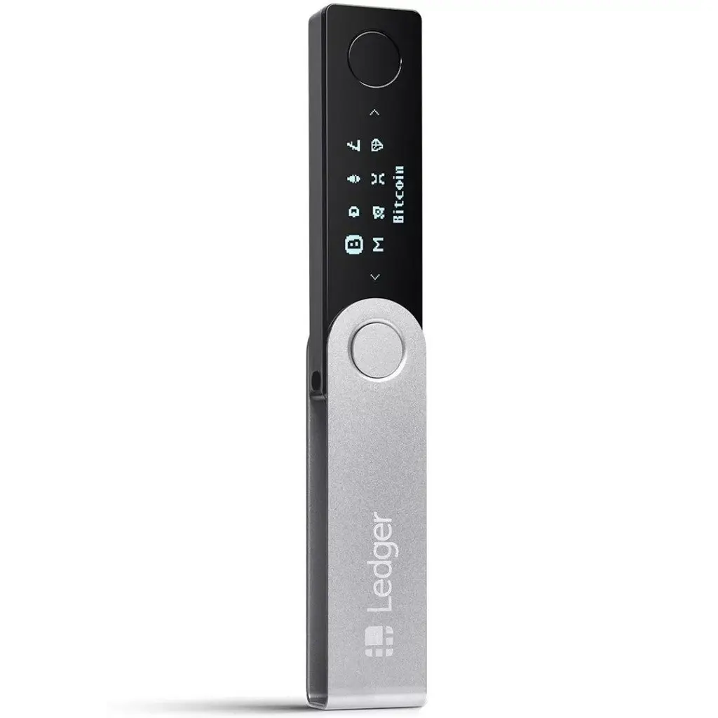 A silver Ledger Nano X hardware wallet showing Bitcoin on its small digital screen against a white background.