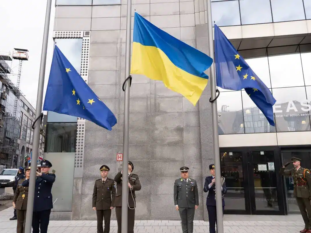 European Union and Ukrainian flags flying in front of the European External Action Service building in Brussels