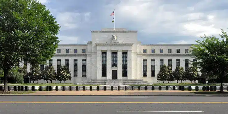 The neoclassical white marble facade of the Federal Reserve Board building in Washington, D.C.