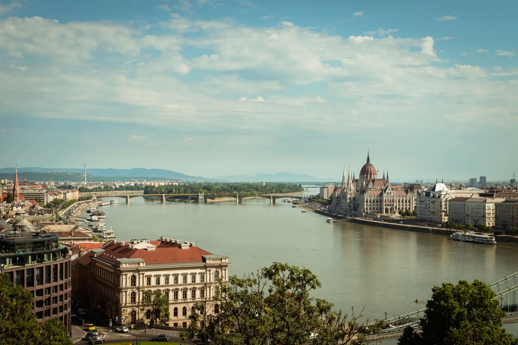 Aerial view of Budapest featuring the Danube River and the Hungarian Parliament Building