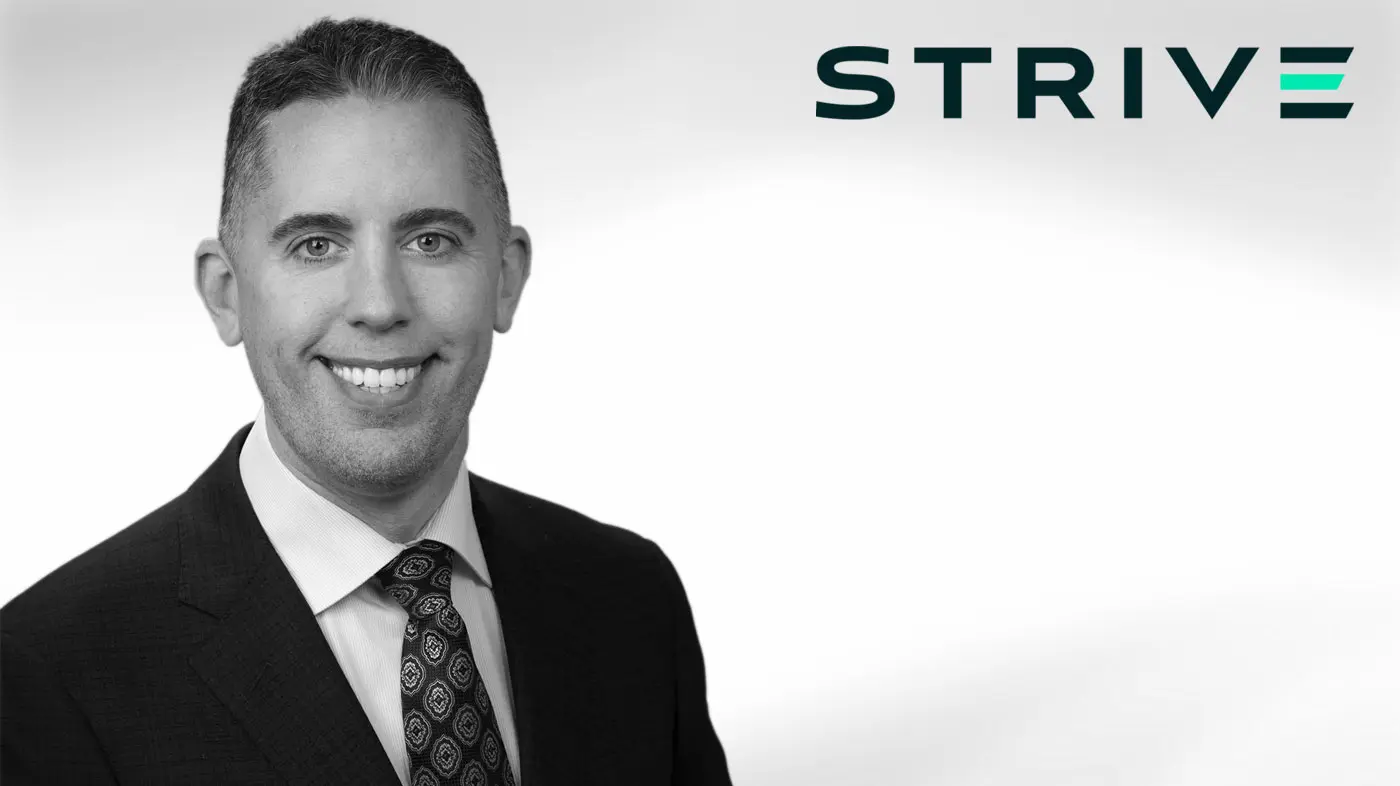Headshot of Matt Cole, CEO of Strive, wearing a suit and tie against a white background with the Strive logo.