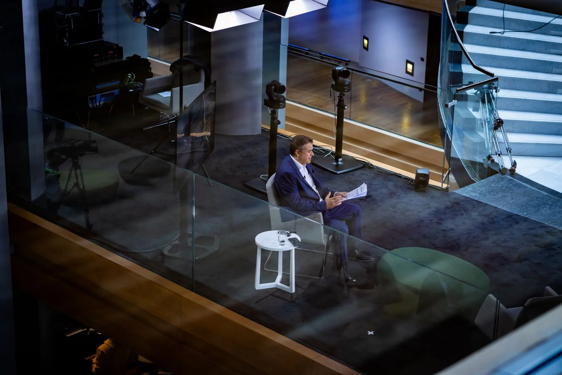Matthew Sigel of VanEck sitting in a chair at a CNBC television studio set