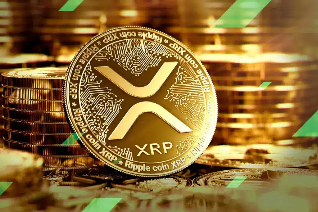 A gold-colored XRP cryptocurrency token featuring the Ripple logo and circuit board patterns.