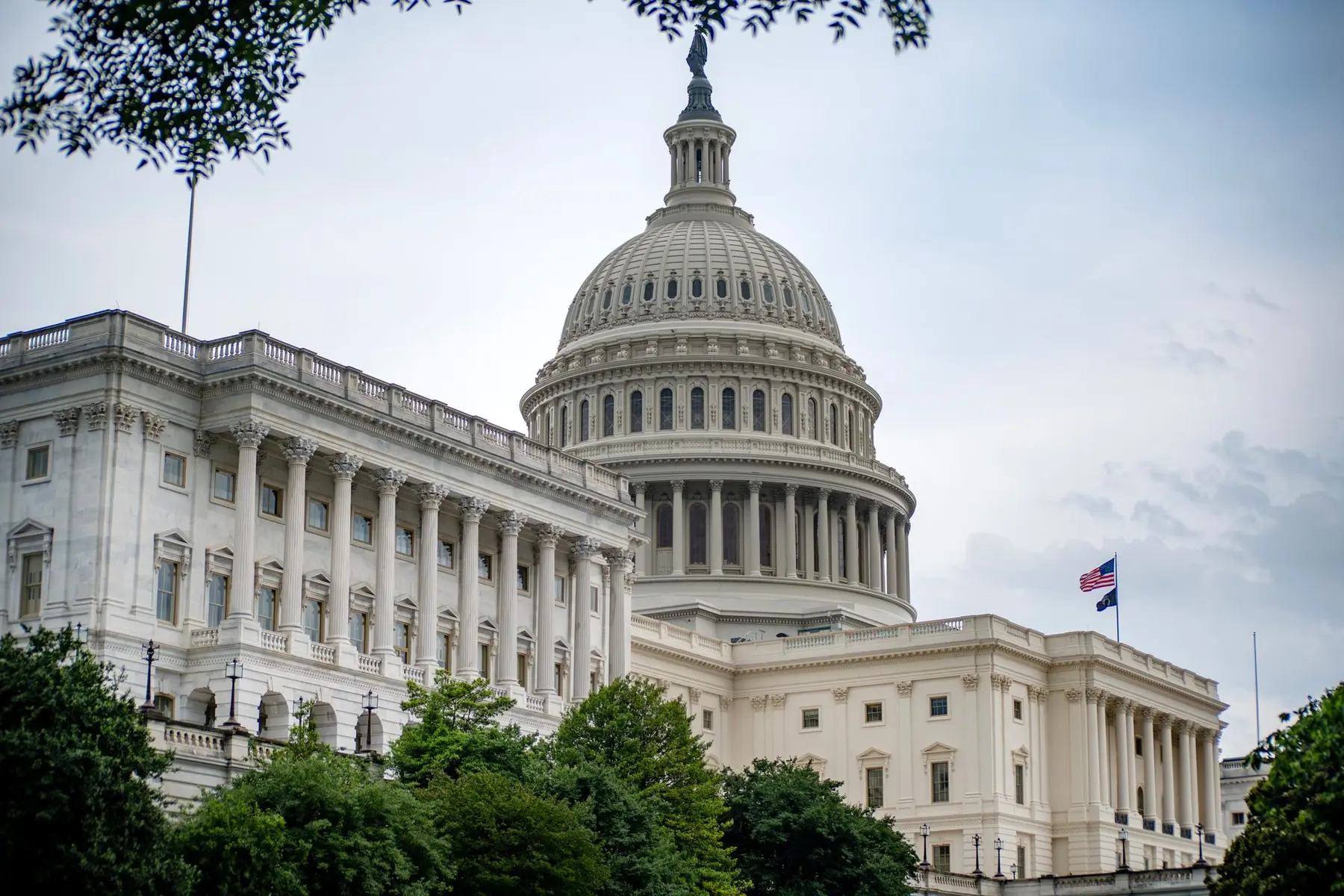 The US Capitol building in Washington D.C. featuring the central dome and white neoclassical facade.