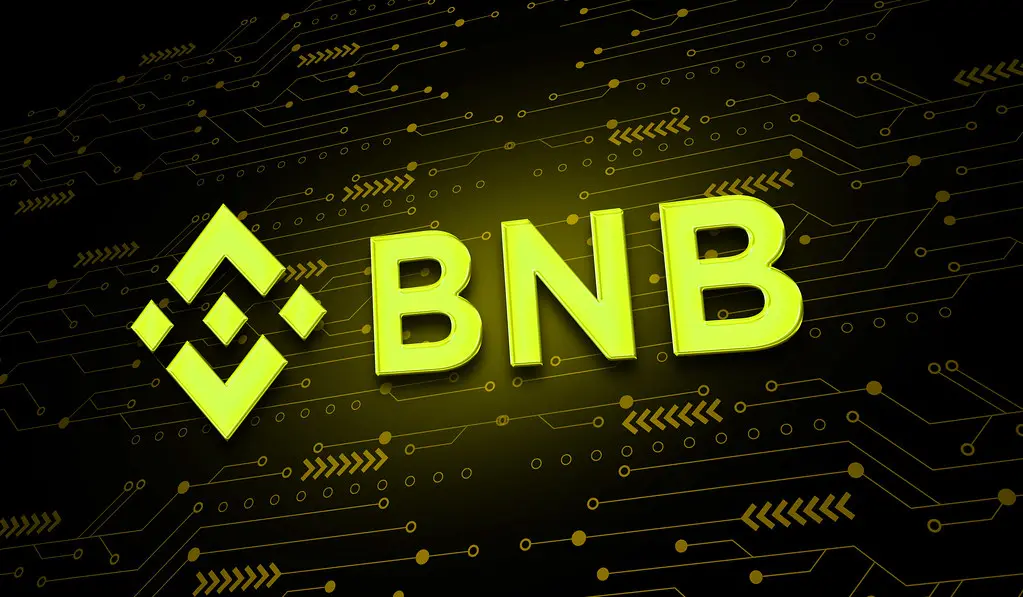 Das gelbe Binance-Logo neben dem Schriftzug BNB vor einem dunklen Hintergrund mit Schaltkreis-Design.