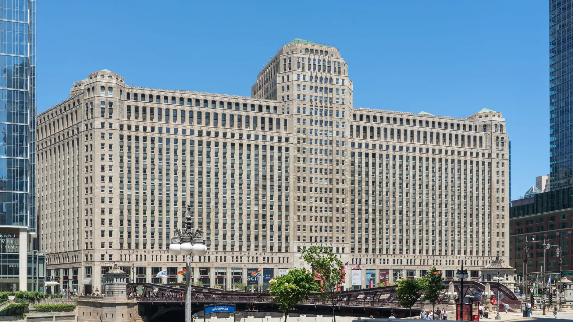 Wide shot of the historic CME Group building exterior in Chicago under a clear blue sky