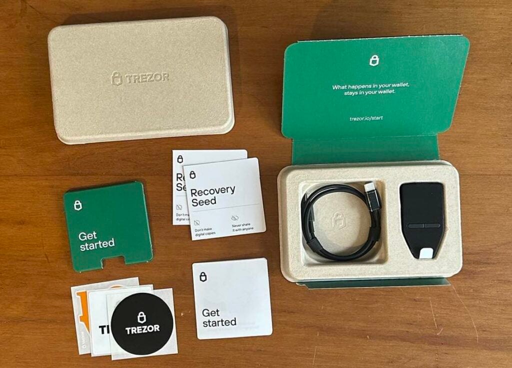 The Trezor Safe 3 hardware wallet, along with the contents that come in the box, from TREZOR