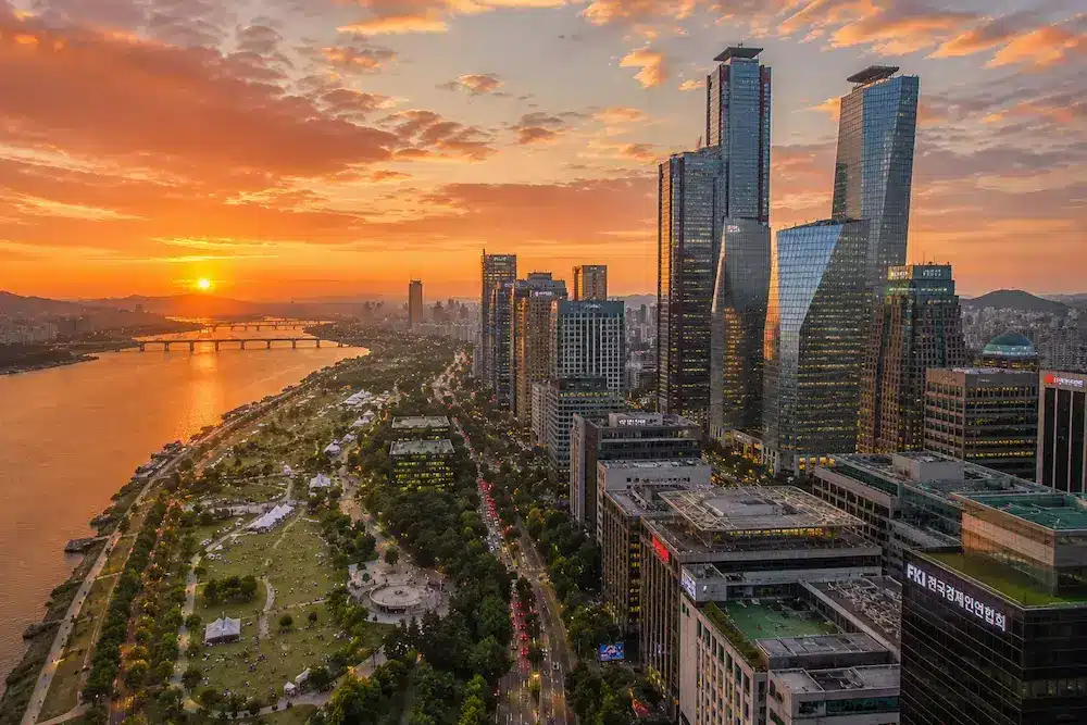 Aerial view of Seoul's Yeouido financial district skyline and Han River at sunset